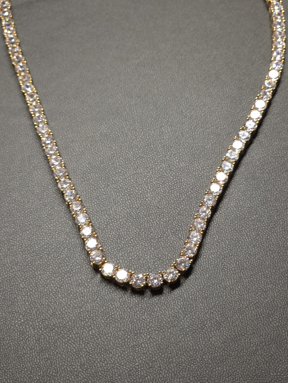 Classic 22-inch tennis necklace featuring a continuous row of sparkling clear st